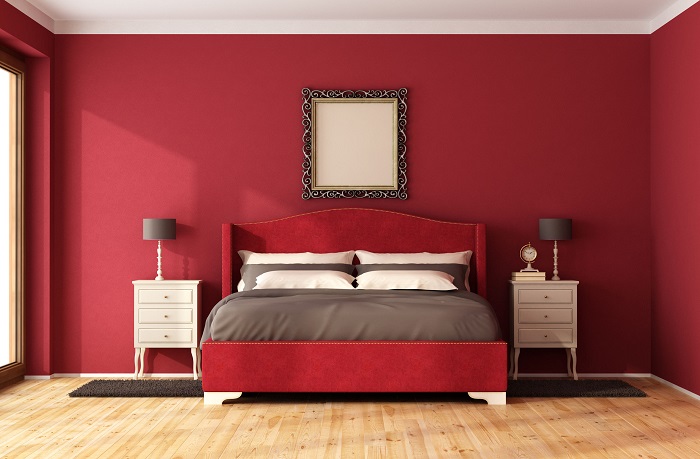 Bedroom painted with red colour